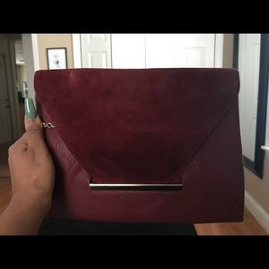 Purple clutch with shoulder chain